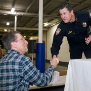 Ray Fagundes is honored by Lemoore Chief of Police Darrell Smith for his volunteer work.